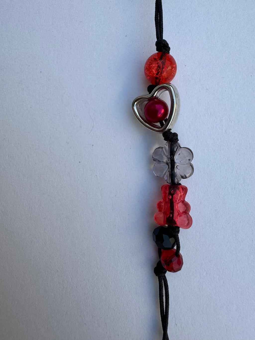 Reddish Black Comet Charm