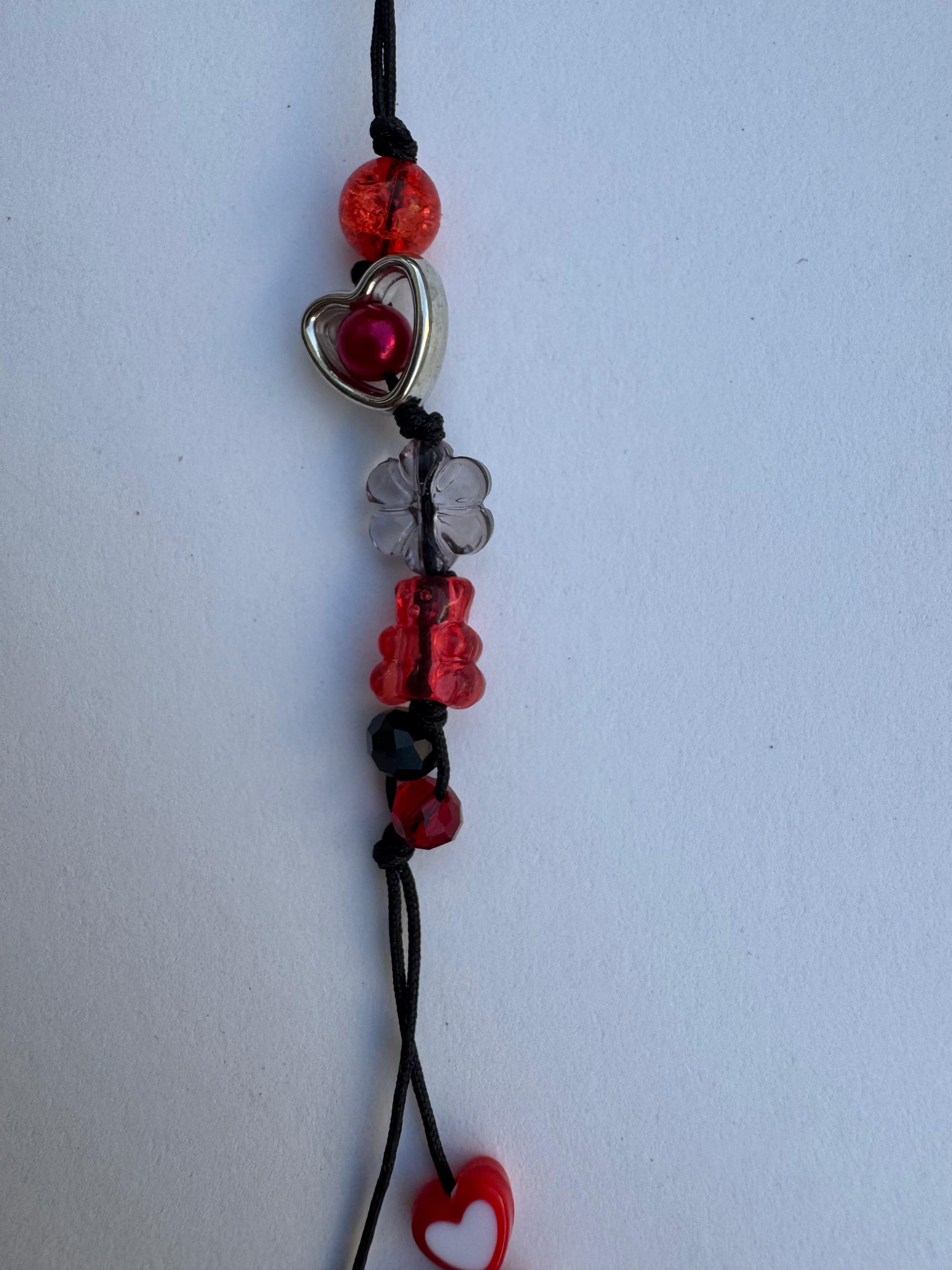 Reddish Black Comet Charm